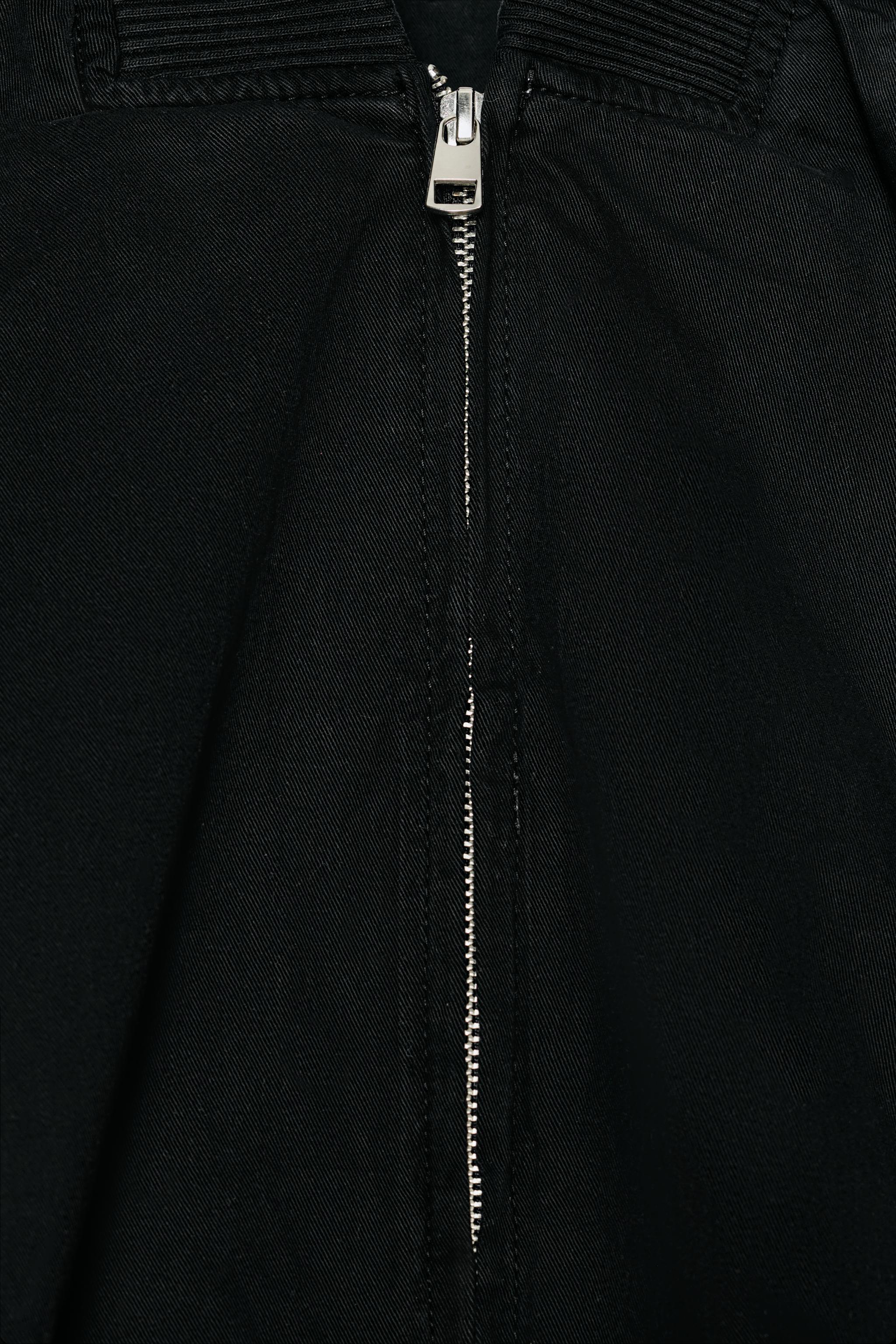 VESTE BOMBER À BAS ASYMÉTRIQUE